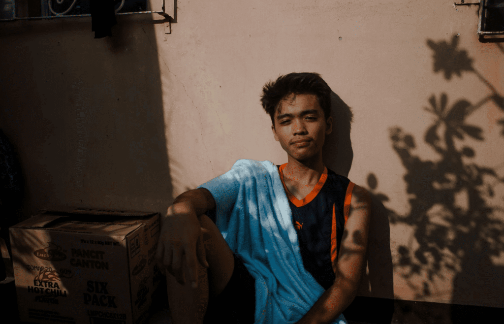A teen in ’80s clothes looking disgusted