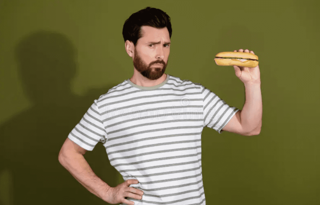 A confused person looking at a small sandwich