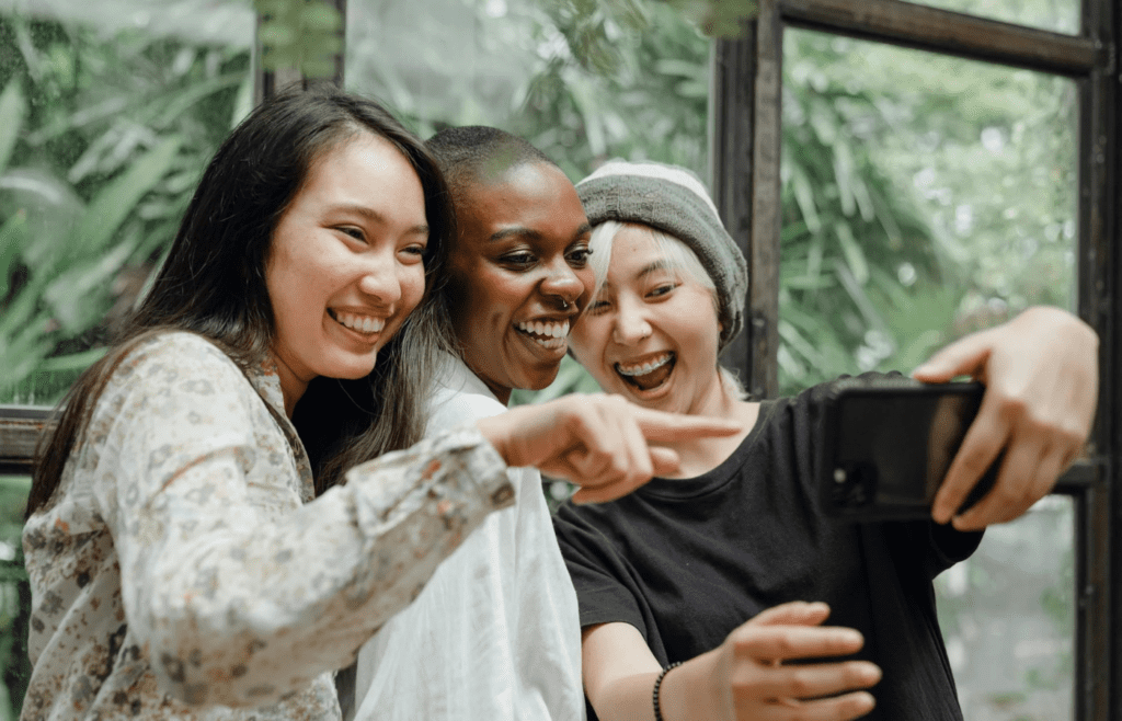 A friend group cheering someone on
