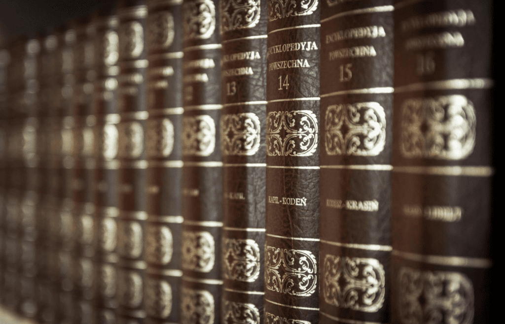 A set of encyclopedias on a bookshelf