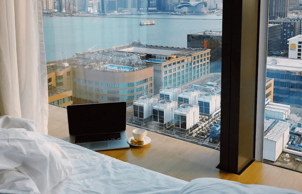 A beachside hotel room with a printed receipt on the bed