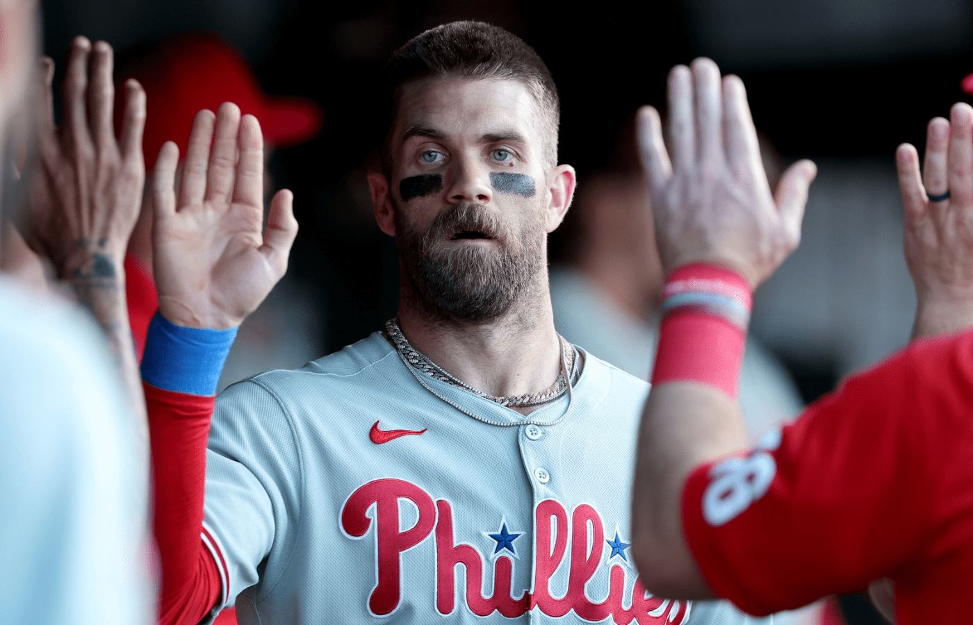 May 24, 2025; West Sacramento, California, USA; Philadelphia Phillies first baseman Bryce Harper (3) is congratulated by teammates in the dugout after scoring a run against the Athletics during the first inning at Sutter Health Park. Mandatory Credit: Dennis Lee-Imagn Images