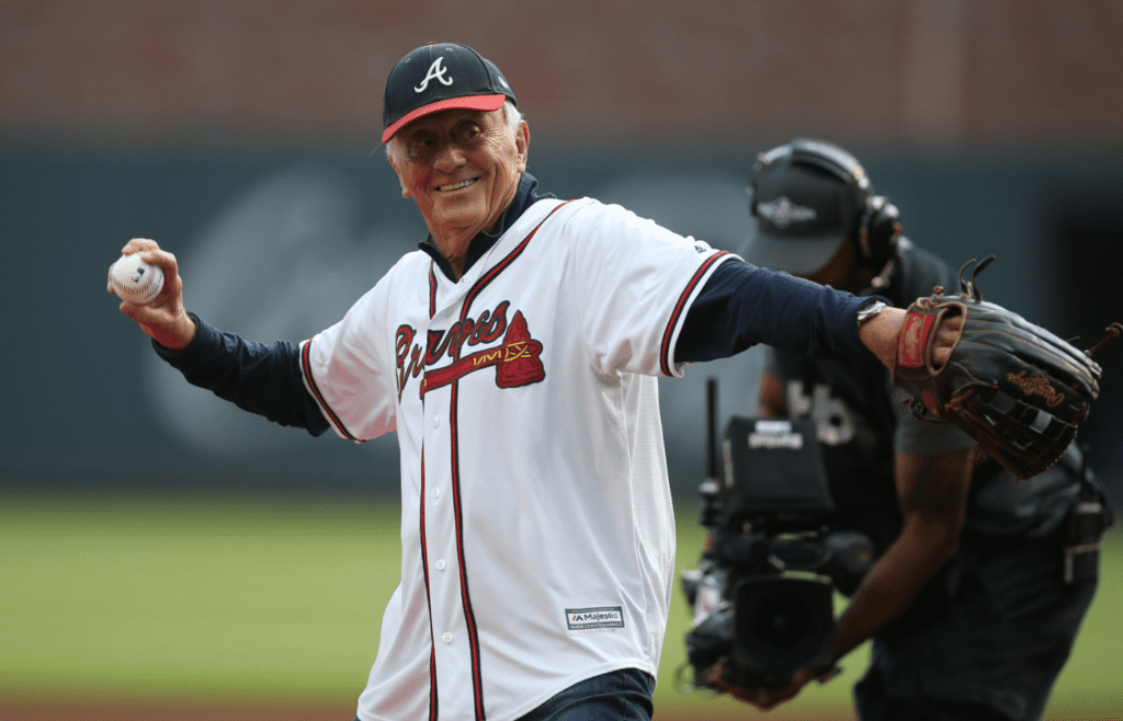 Oct 9, 2019; Atlanta, GA, USA; Atlanta Braves former pitcher Phil Niekro throws out a ceremonial first pitch before game five of the 2019 NLDS playoff baseball series against the St. Louis Cardinals at SunTrust Park. Mandatory Credit: Brett Davis-Imagn Images