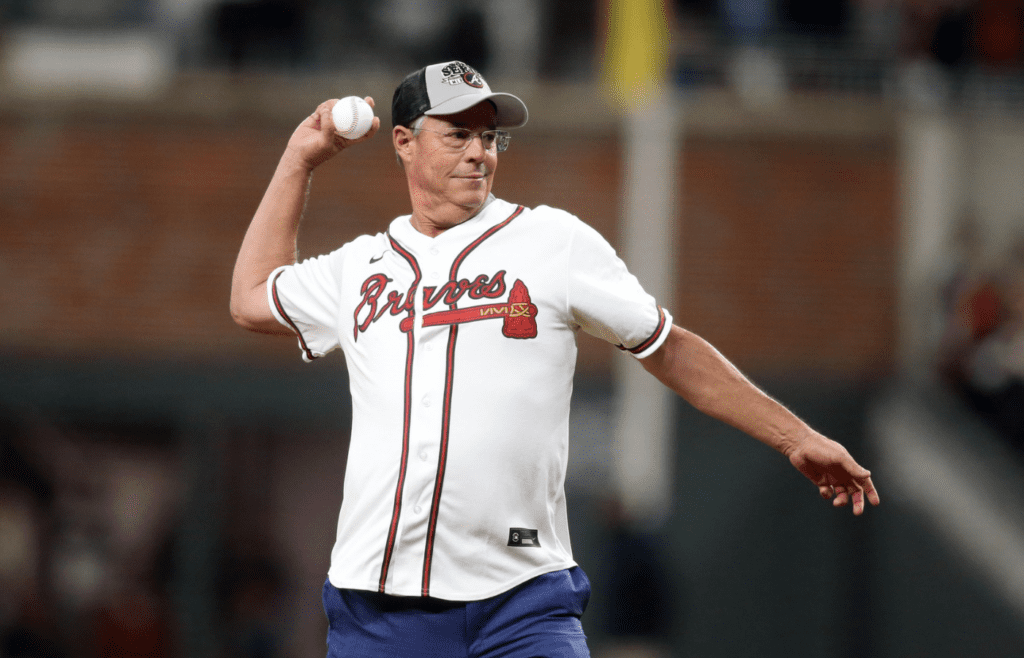 Oct 31, 2021; Atlanta, Georgia, USA; Atlanta Braves hall of fame pitcher Greg Maddux throws out the ceremonial first pitch prior to game five of the 2021 World Series against the Houston Astros at Truist Park. Mandatory Credit: Brett Davis-Imagn Images