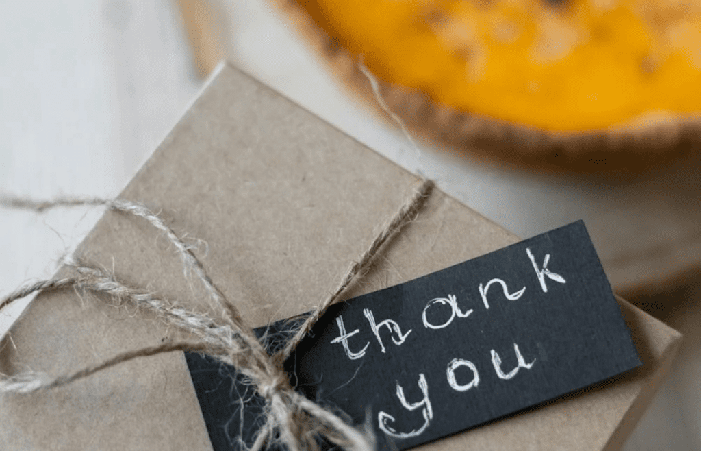 A cozy Airbnb rental with a “thank you” card on the table