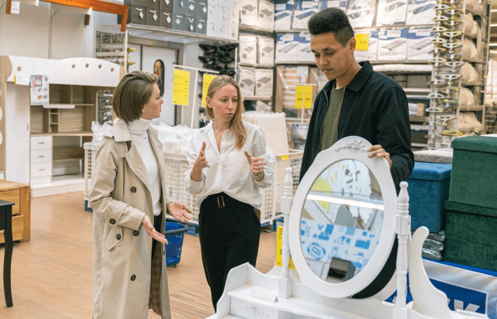 Salesperson explaining warranty terms to customers