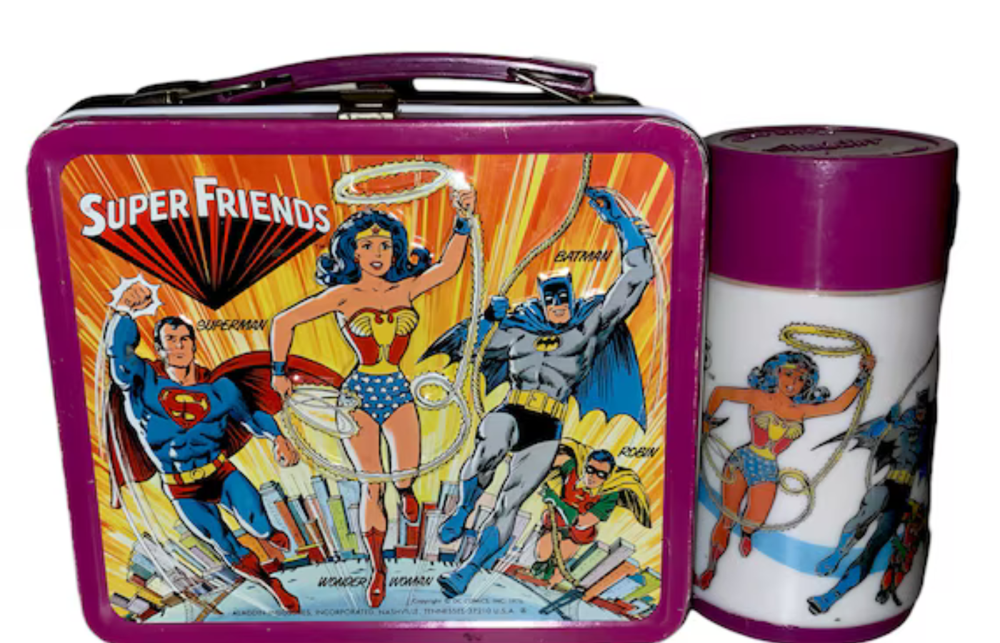 A metal lunchbox with cartoon graphics and matching thermos