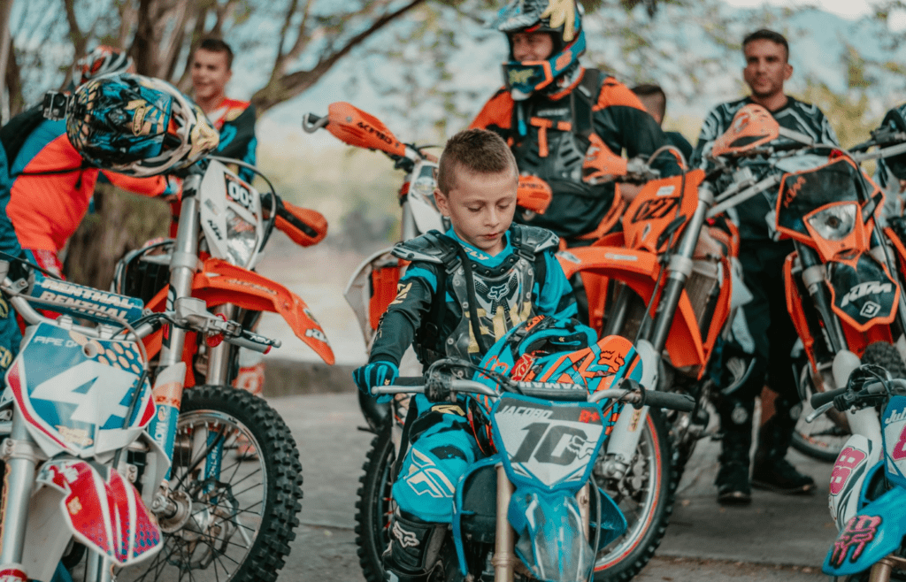 Kids racing bikes with wind in their hair and no helmets