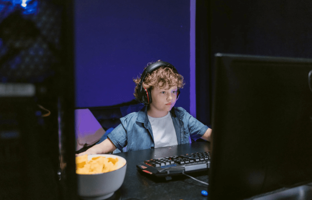 A kid with giant headphones and a cassette player