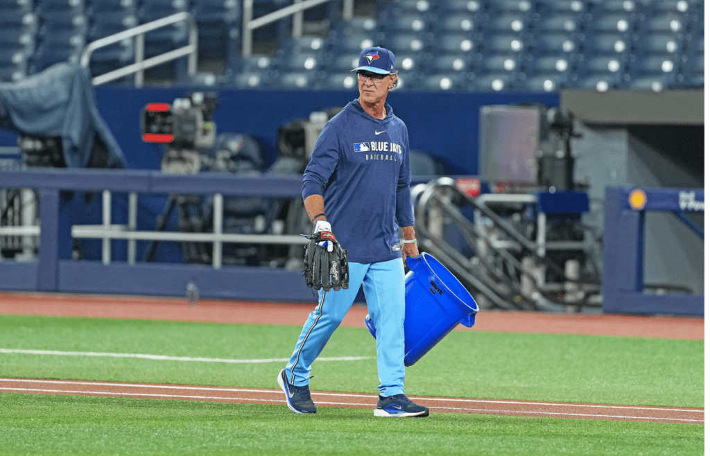 Apr 2, 2025; Toronto, Ontario, CAN; Toronto Blue Jays bench coach Don Mattingly (46) walks with the container of baseballs during batting practice before a game against the Washington Nationals at Rogers Centre. Mandatory Credit: Nick Turchiaro-Imagn Images