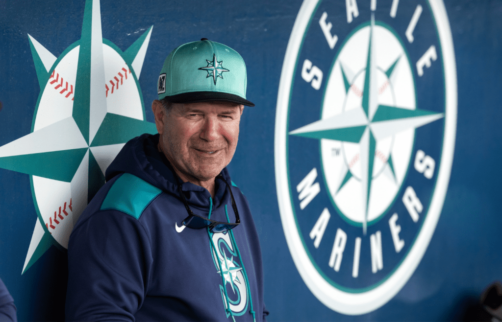 Mar 3, 2025; Peoria, Arizona, USA; Seattle Mariners director of hitting strategy Edgar Martinez in the dugout against the Cleveland Guardians during a spring training game at Peoria Sports Complex. Mandatory Credit: Mark J. Rebilas-Imagn Images