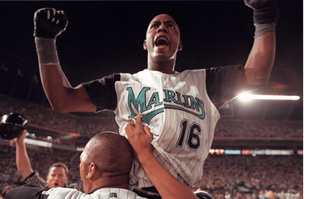 10/27/97...PPS...Edgar Renteria is lifted in the air by Gary Sheffield after game winning hit in the 11th inning of the World Series against the Indians. Staff photo by Allen Eyestone ORG XMIT: ORG XMIT: MER0707080859100007