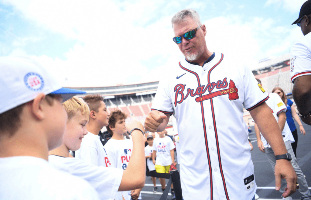 MLB’s Chipper Jones fist bumps a fan at a press conference announcing a game between the Atlanta Braves and the Cincinnati Reds at Bristol Motor Speedway, at Bristol Motor Speedway in Bristol, Tenn., Friday, Aug. 9, 2024.