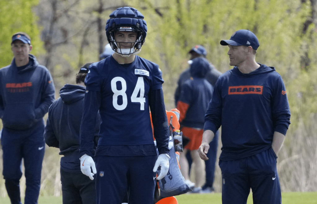 May 10, 2025; Lake Forest, IL, USA; Chicago Bears head coach Ben Johnson talks with tight end (84) Colston Loveland during Rookie Minicamp at Halas Hall. Mandatory Credit: David Banks-Imagn Images
