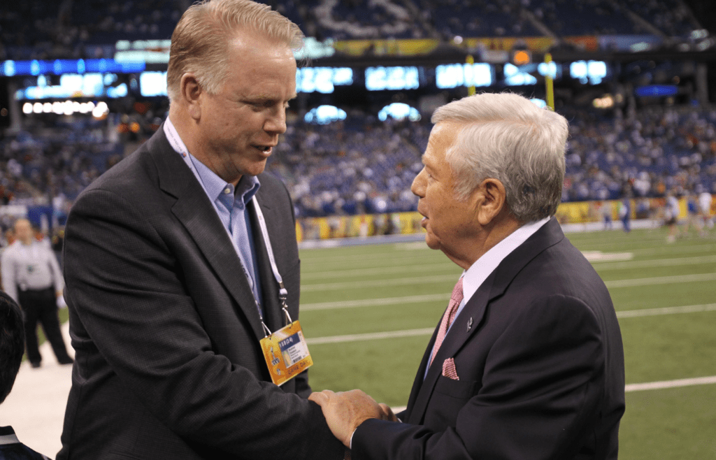 Feb 5, 2012; Indianapolis, IN, USA; NFL former quarterback Boomer Esiason (left) talks to New England Patriots owner Robert Kraft (right) before Super Bowl XLVI against the New York Giants at Lucas Oil Stadium. Mandatory Credit: Matthew Emmons-Imagn Images