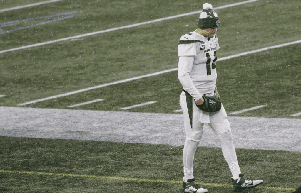 Jan 3, 2021; Foxborough, Massachusetts, USA; New York Jets quarterback Sam Darnold (14) walks alone on the sidelines during the second half of their loss to the New England Patriots at Gillette Stadium. Mandatory Credit: Winslow Townson-Imagn Images