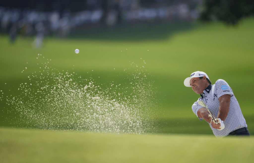 May 16, 2025; Charlotte, North Carolina, USA; Patrick Reed hits his ball out of the bunker on the fifteenth hole during the second round of the PGA Championship golf tournament at Quail Hollow. Mandatory Credit: Aaron Doster-Imagn Images