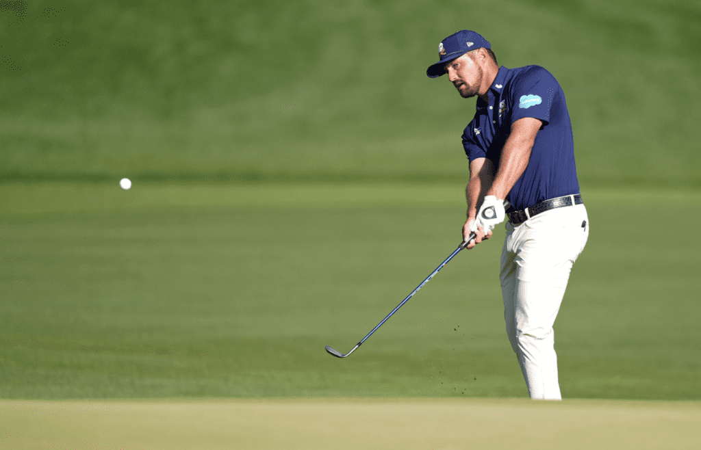May 18, 2025; Charlotte, North Carolina, USA; Bryson DeChambeau takes a shot on the 18th hole during the final round of the PGA Championship golf tournament at Quail Hollow. Mandatory Credit: Jim Dedmon-Imagn Images
