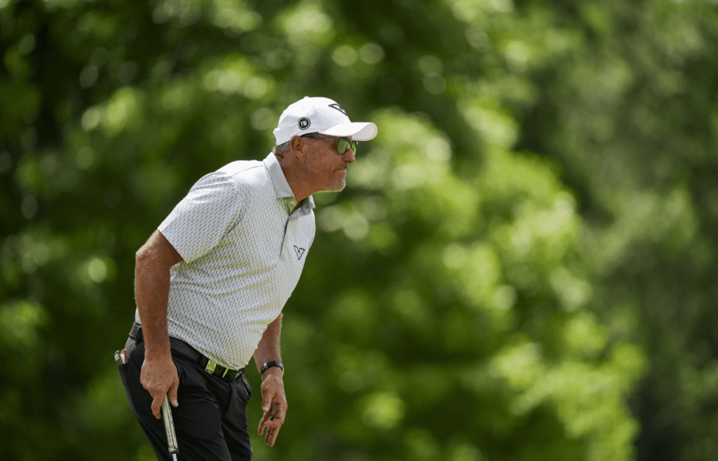 May 15, 2025; Charlotte, North Carolina, USA; Phil Mickelson lines up his putt on the ninth hole during the first round of the PGA Championship golf tournament at Quail Hollow. Mandatory Credit: Aaron Doster-Imagn Images