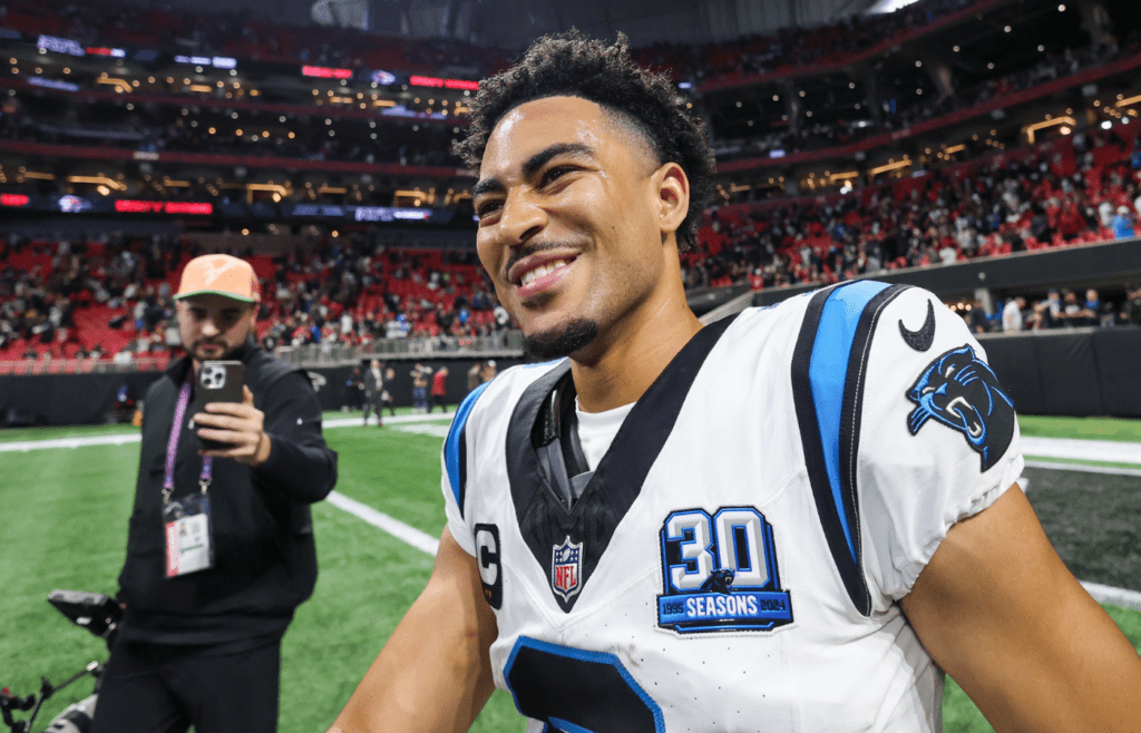 Jan 5, 2025; Atlanta, Georgia, USA; Carolina Panthers quarterback Bryce Young (9) celebrates after a victory over the Atlanta Falcons in overtime at Mercedes-Benz Stadium. Mandatory Credit: Brett Davis-Imagn Images