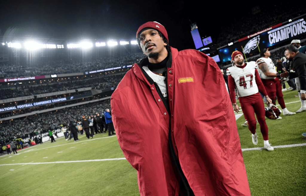 Jan 26, 2025; Philadelphia, PA, USA; Washington Commanders quarterback Jayden Daniels (5) walks off the field after losing the NFC Championship game against the Philadelphia Eagles at Lincoln Financial Field. Mandatory Credit: Eric Hartline-Imagn Images