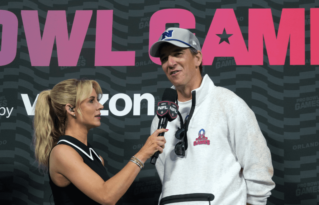 Feb 2, 2025; Orlando, FL, USA; ESPN reporter Laura Rutledge interviews NFC coach Eli Manning during the 2025 Pro Bowl Games at Camping World Stadium. Mandatory Credit: Kirby Lee-Imagn Images