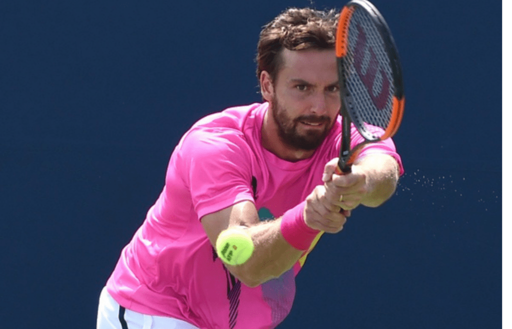 Aug 4, 2018; Toronto, Ontario, Canada; Ernests Gulbis of Latvia hits a shot against Ryan Harrison of the USA (not shown) in the Rogers Cup tennis tournament at Aviva Centre. Mandatory Credit: Dan Hamilton-Imagn Images