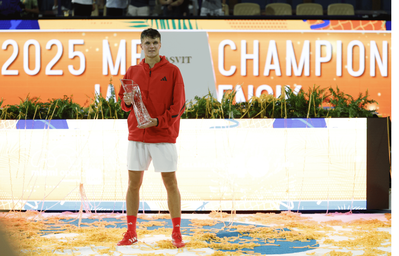 Mar 30, 2025; Miami, FL, USA; Jakub Mensik (CZE) celebrates with the Butch Buchholz championship trophy after his match against Novak Djokovic (SRB)(not pictured) in the men's singles championship of the Miami Open at Hard Rock Stadium. Mandatory Credit: Geoff Burke-Imagn Images