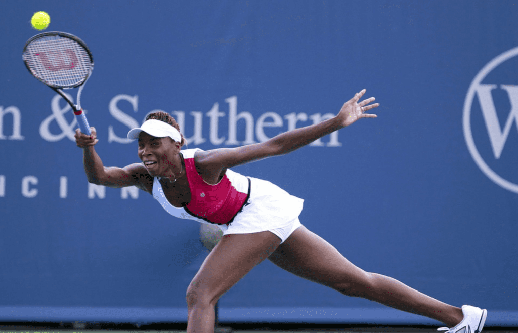 Venus Williams lunges for a shot during her 6-2, 6-7 (2), 6-4 quarterfinal victory over Sam Stosure Friday afternoon. Venus is in the semifinals here for the first time. The Enquirer/Cara Owsley Venus Williams returns a serve from Samantha Stosur on the grandstand during the Western and Southern Open at the Lindner Family Tennis Center. Photo shot on Friday August 17, 2012.Western and Southern Open at the Lindner Family Tennis Center. Photo shot on Friday August 17, 2012.