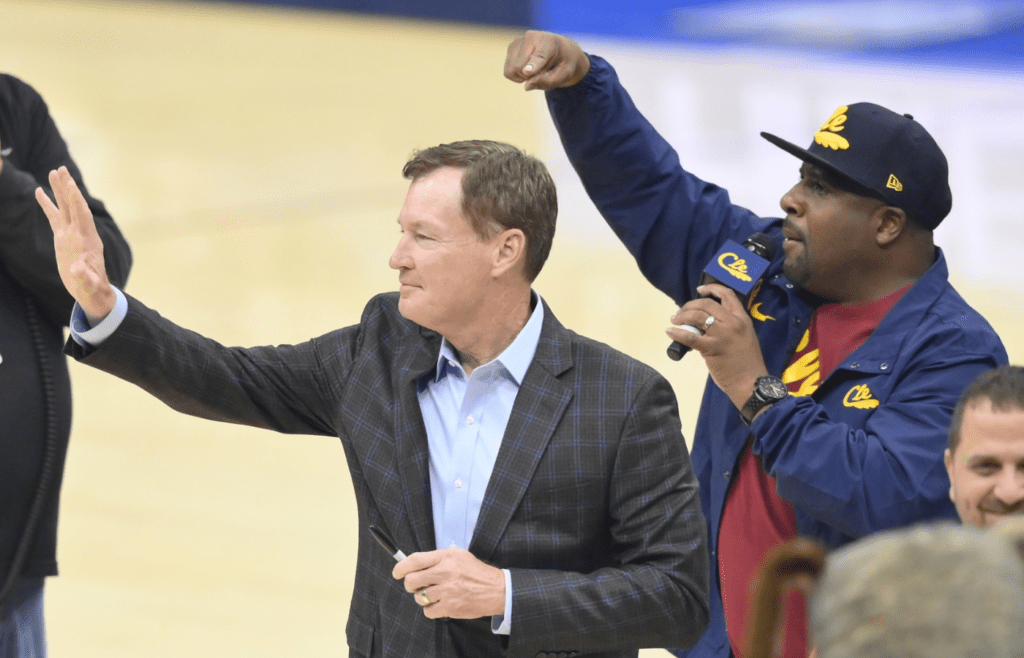 Jan 4, 2020; Cleveland, Ohio, USA; Former Cleveland Cavaliers point guard Mark Price, left, reacts to fans in the first quarter of a game between the Cleveland Cavaliers and the Oklahoma City Thunder at Rocket Mortgage FieldHouse. Mandatory Credit: David Richard-Imagn Images