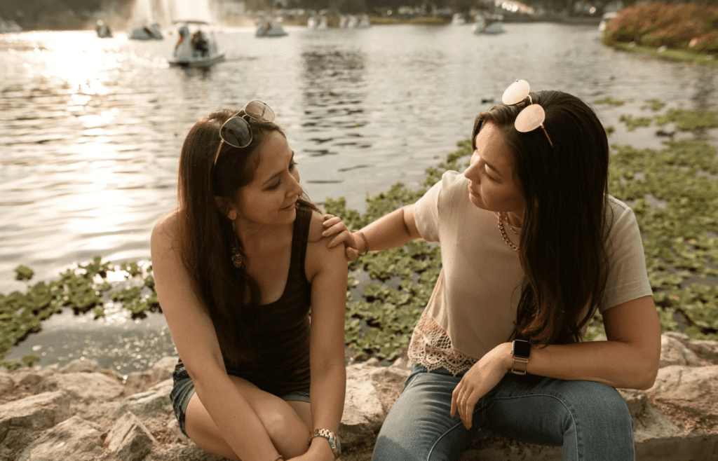 A person talking while others look annoyed
