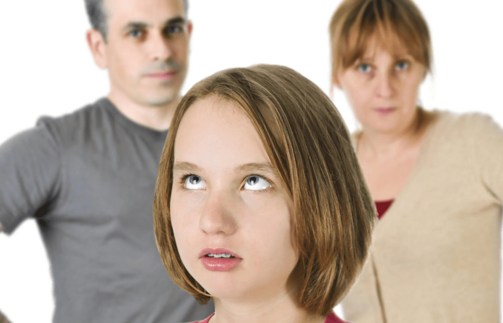 A person rolling their eyes while someone else speaks