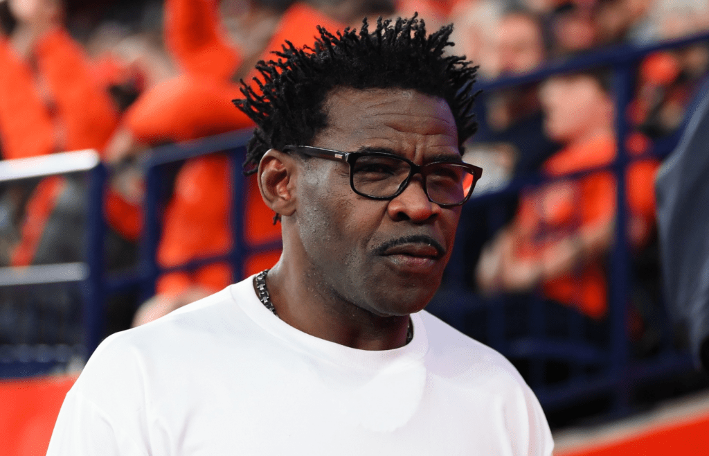 Nov 30, 2024; Syracuse, New York, USA; Miami Hurricanes former player and NFL Hall of Fame member Michael Irvin looks on during the first half of a game between the Miami Hurricanes and the Syracuse Orange at the JMA Wireless Dome. Mandatory Credit: Rich Barnes-Imagn Images