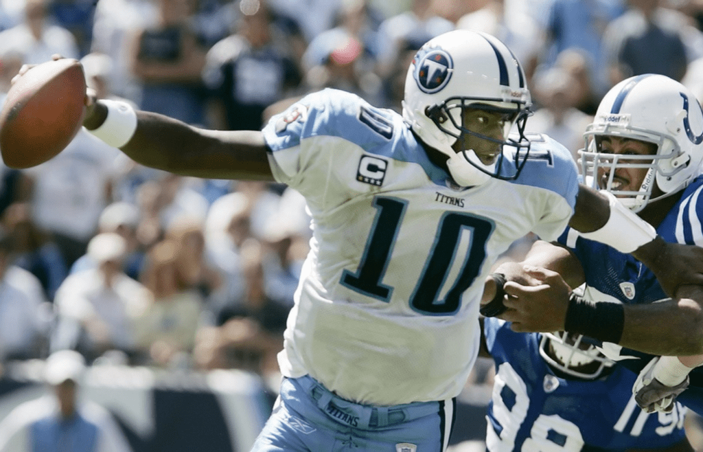 Tennessee Titans quarterback Vince Young (10) scrambles to get away from Indianapolis colts defenders at LP field in Nashville on Sept 16, 2007. The Titans lost their home opener 22-20