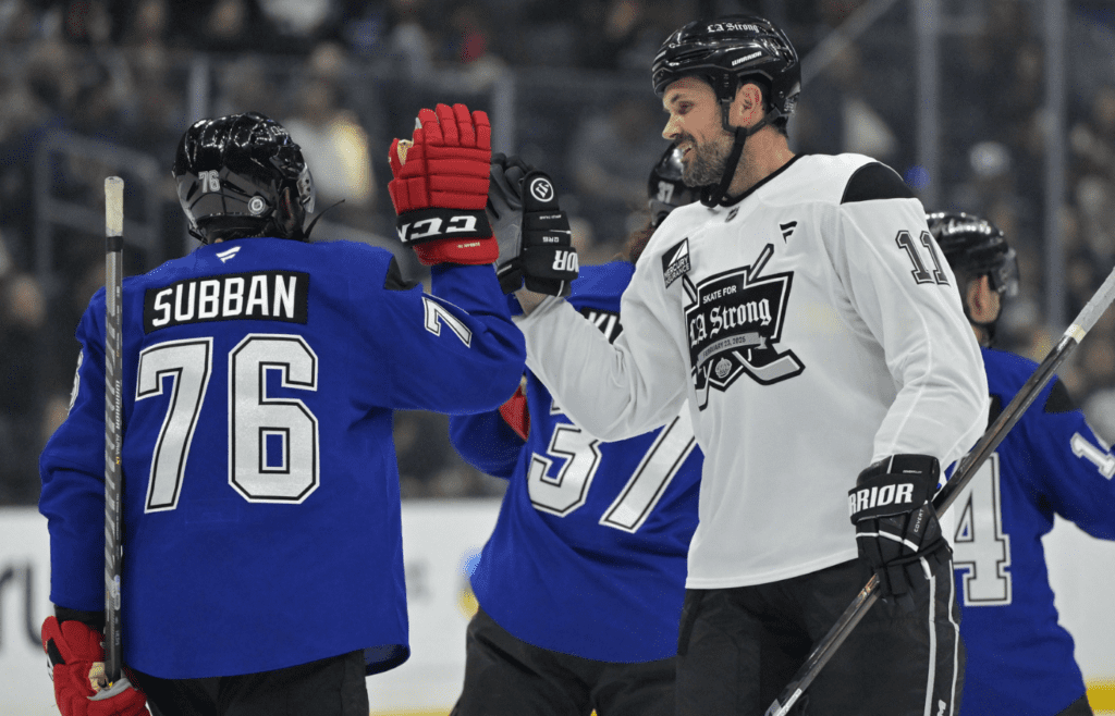 Feb 23, 2025; Los Angeles, CA, USA; Former NHL player PK Subban give a fist pump to former NFL quarterback Matt Leinart after their game at the Los Angeles Kings Celebrity Charity Game for LA Wildfire Relief at Crypto.com Arena. teams. Mandatory Credit: Jayne Kamin-Oncea-Imagn Images