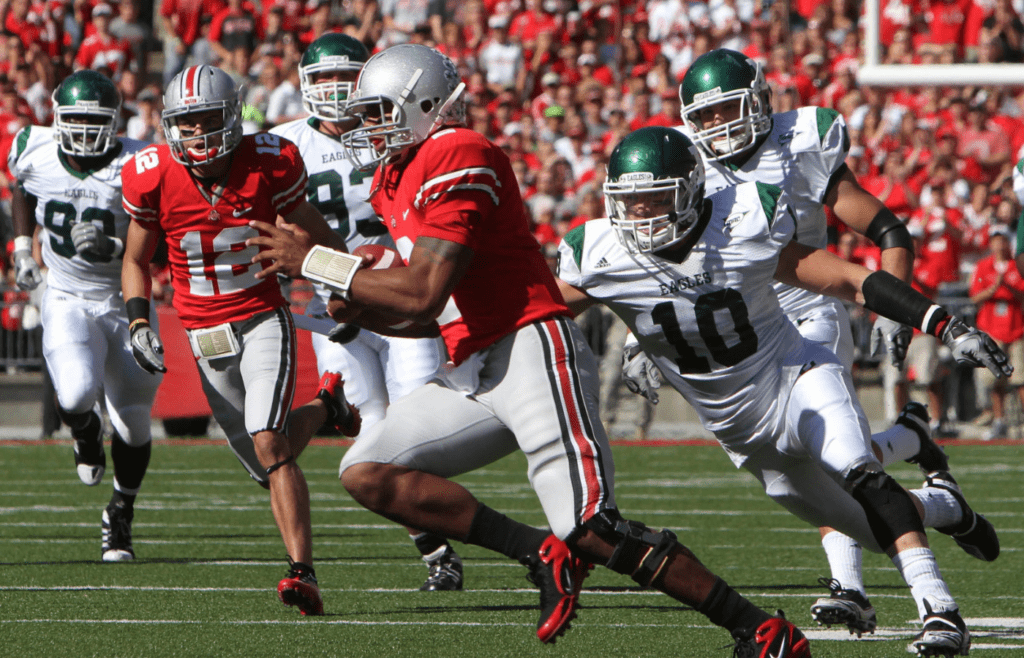 Ohio State quarterback Terrelle Pryor (2) slips past Eastern Michigan cornerback Ryan Downard (10) for a touchdown during the first quarter of their NCAA football game at Ohio Stadium on September 25, 2010. (The Columbus Dispatch photo by Neal C. Lauron) Osu 10 Emu Ncl 0538