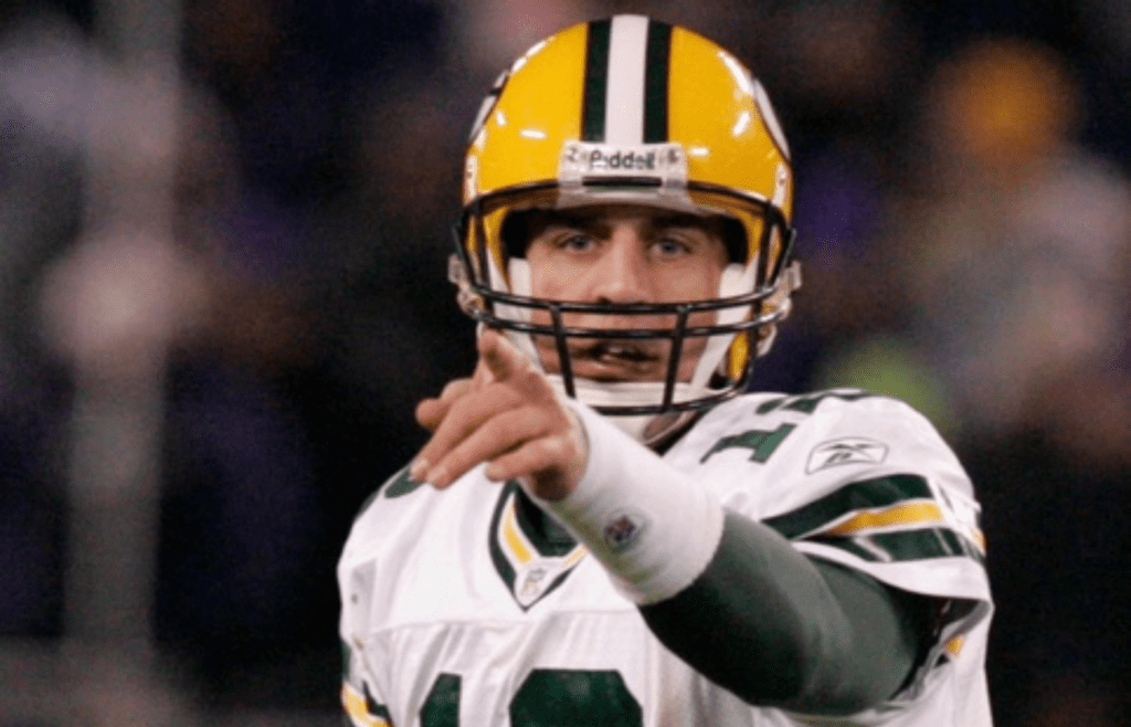 Rookie quarterback Aaron Rodgers looks for an open receiver during the fourth quarter of the Green Bay Packers' 48-3 loss to the Baltimore Ravens on Monday, Dec. 19, 2005, at M&T Bank Stadium in Baltimore, Maryland. Rodgers relieved Brett Favre, who was taken out of the game with the game out of hand after completing just 48% of his passes for 144 yards and two interceptions. Rodgers was 8 of 15 for 65 yards and one interception.