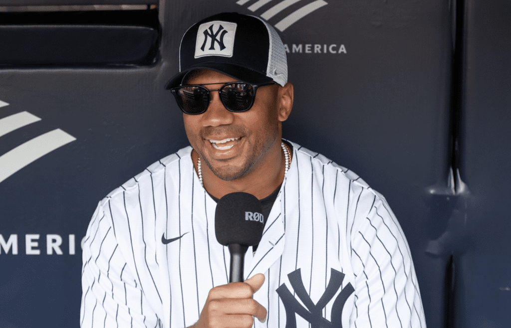 May 18, 2025; Bronx, New York, USA; New York Giants quarterback Russell Wilson is interviewed prior to the game between the New York Mets and the New York Yankees at Yankee Stadium. Mandatory Credit: Wendell Cruz-Imagn Images