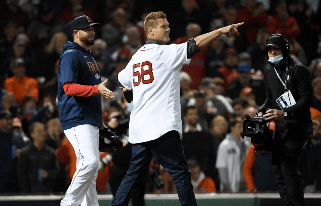 Oct 18, 2021; Boston, Massachusetts, USA; Former Boston Red Sox pitcher Jonathan Papelbon points to the crowd during a ceremonial first pitch before game three of the 2021 ALCS against the Houston Astros at Fenway Park. Mandatory Credit: Bob DeChiara-Imagn Images