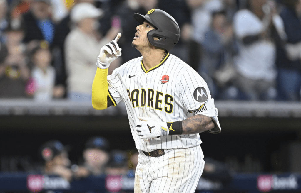 May 26, 2025; San Diego, California, USA; San Diego Padres third baseman Manny Machado (13) celebrates after hititng a solo home run during the eighth inning against the Miami Marlins at Petco Park. Mandatory Credit: Denis Poroy-Imagn Images
