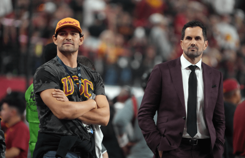 Dec 2, 2022; Las Vegas, NV, USA; Southern California Trojans former quarterbacks Mark Sanchez (left) and Matt Leinart watch from the sidelines during the Pac-12 Championship game against the Utah Utes at Allegiant Stadium. Mandatory Credit: Kirby Lee-Imagn Images