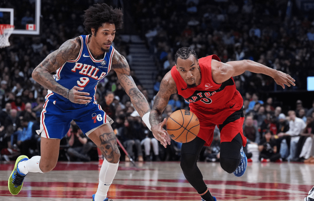 Mar 12, 2025; Toronto, Ontario, CAN; Toronto Raptors guard A.J. Lawson (0) battles for the ball with Philadelphia 76ers guard Kelly Oubre Jr. (9) during the third quarter at the Scotiabank Arena. Mandatory Credit: Nick Turchiaro-Imagn Images