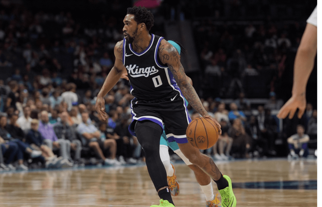 Apr 4, 2025; Charlotte, North Carolina, USA; Sacramento Kings guard Malik Monk (0) drives to the basket against the Charlotte Hornets during the second quarter at Spectrum Center. Mandatory Credit: Jim Dedmon-Imagn Images