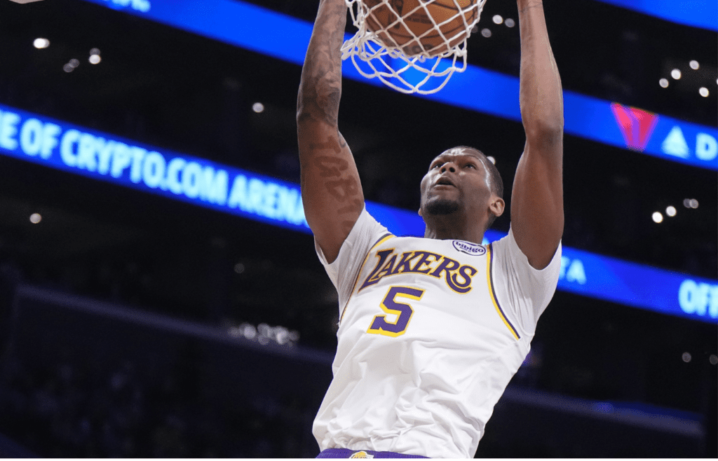 Dec 15, 2024; Los Angeles, California, USA; Los Angeles Lakers forward Cam Reddish (5) dunks the ball in the first half against the Memphis Grizzlies at Crypto.com Arena. Mandatory Credit: Kirby Lee-Imagn Images