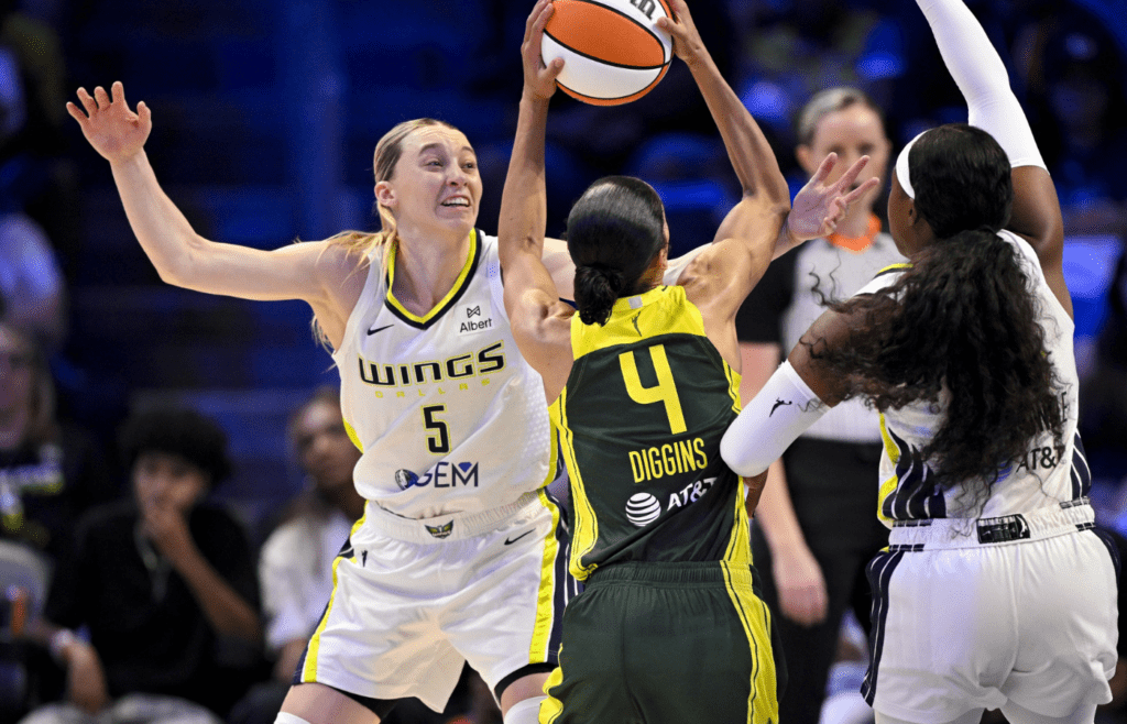 May 19, 2025; Arlington, Texas, USA; Dallas Wings guard Paige Bueckers (5) and Seattle Storm guard Skylar Diggins (4) in action during the game between the Dallas Wings and the Seattle Storm at College Park Center. Mandatory Credit: Jerome Miron-Imagn Images