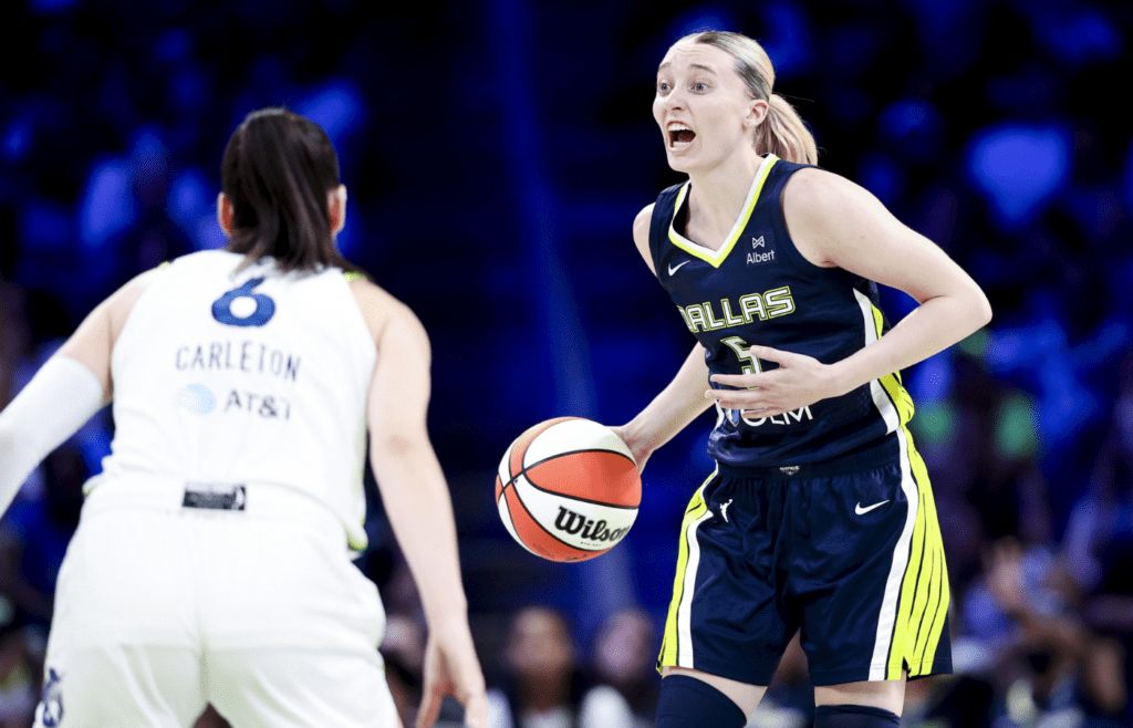 May 16, 2025; Arlington, Texas, USA; Dallas Wings guard Paige Bueckers (5) yells as Minnesota Lynx forward Bridget Carleton (6) defends during the second half at College Park Center. Mandatory Credit: Kevin Jairaj-Imagn Images
