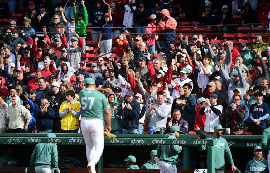 May 24, 2025; Boston, Massachusetts, USA; Boston Red Sox fans cheer after relief pitcher Greg Weissert (57) pitches during the tenth inning against the Baltimore Orioles at Fenway Park. Mandatory Credit: Bob DeChiara-Imagn Images