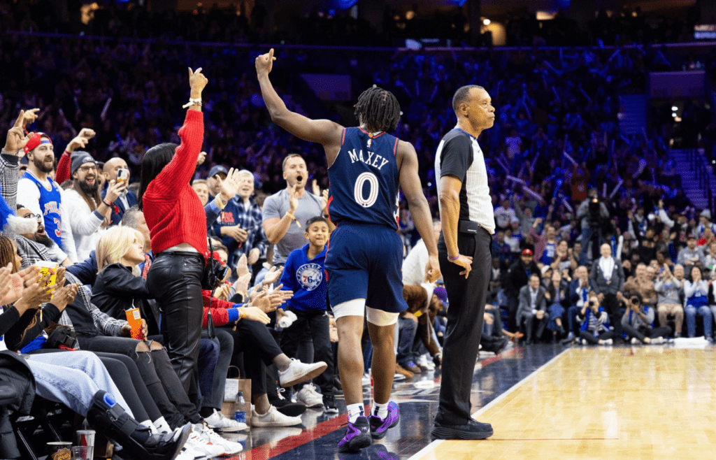 Dec 20, 2023; Philadelphia, Pennsylvania, USA; Philadelphia 76ers guard Tyrese Maxey (0) reacts with fans after his score against the Minnesota Timberwolves during the fourth quarter at Wells Fargo Center. Mandatory Credit: Bill Streicher-Imagn Images