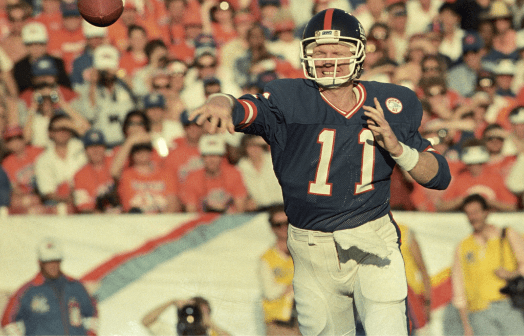 Jan 25, 1987; Pasadena, CA, USA; FILE PHOTO; New York Giants quarterback Phil Simms (11) throws against the Denver Broncos during Super Bowl XXI at the Rose Bowl. The Giants defeated the Broncos 39-20. Mandatory Credit: Bob Deutsch-Imagn Images
