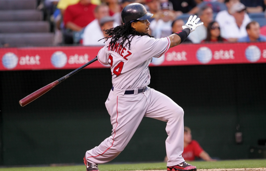 July 18, 2008; Anaheim CA, USA; Boston Red Sox left fielder Manny Ramirez (24) hits a single in the second inning against the Los Angeles Angels at Angel Stadium of Anaheim. Mandatory Credit: Gary A. Vasquez-Imagn Images